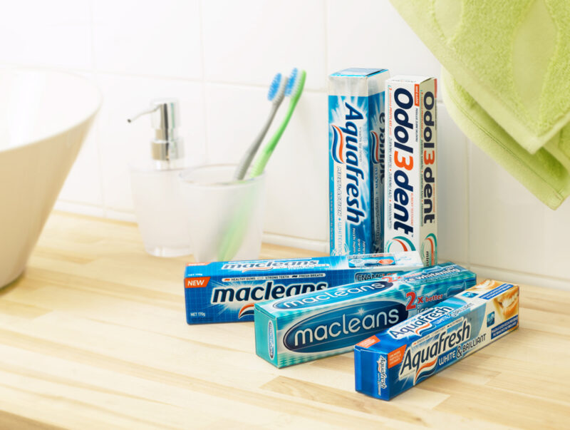 Tootpaste boxes with metalex film on a table